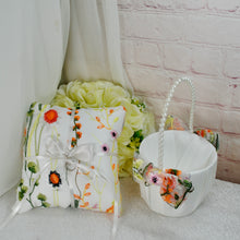 Load image into Gallery viewer, a white flowered pillow and a white flowered basket
