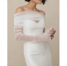 Load image into Gallery viewer, a woman wearing a white dress and gloves