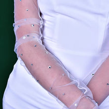 Load image into Gallery viewer, a woman in a white dress with a white dress and white gloves