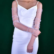 Load image into Gallery viewer, a woman wearing a white dress and gloves