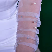 Load image into Gallery viewer, a close up of a person wearing a white dress