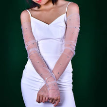 Load image into Gallery viewer, a woman in a white dress with long sleeves