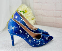 Load image into Gallery viewer, a pair of blue high heeled shoes sitting on top of a table
