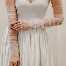 Load image into Gallery viewer, a woman wearing a white dress and gloves
