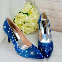 Load image into Gallery viewer, a pair of blue shoes sitting next to a bouquet of flowers
