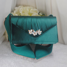 Load image into Gallery viewer, a green purse with flowers on it
