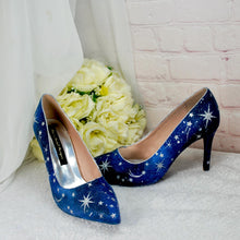 Load image into Gallery viewer, a pair of blue shoes sitting next to a bouquet of flowers
