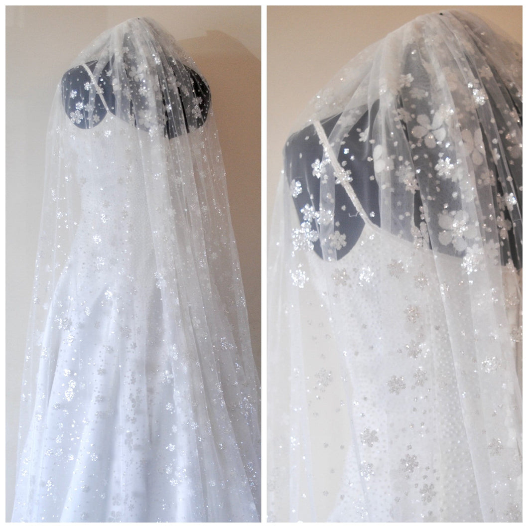 Beautiful white wedding veil sparkling embroidered flowers